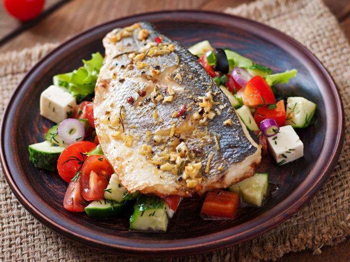 Baked Sea Bass on a Bed of Greek Salad