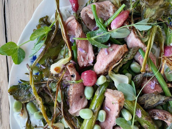 Rose veal with herby yogurt and spring greens