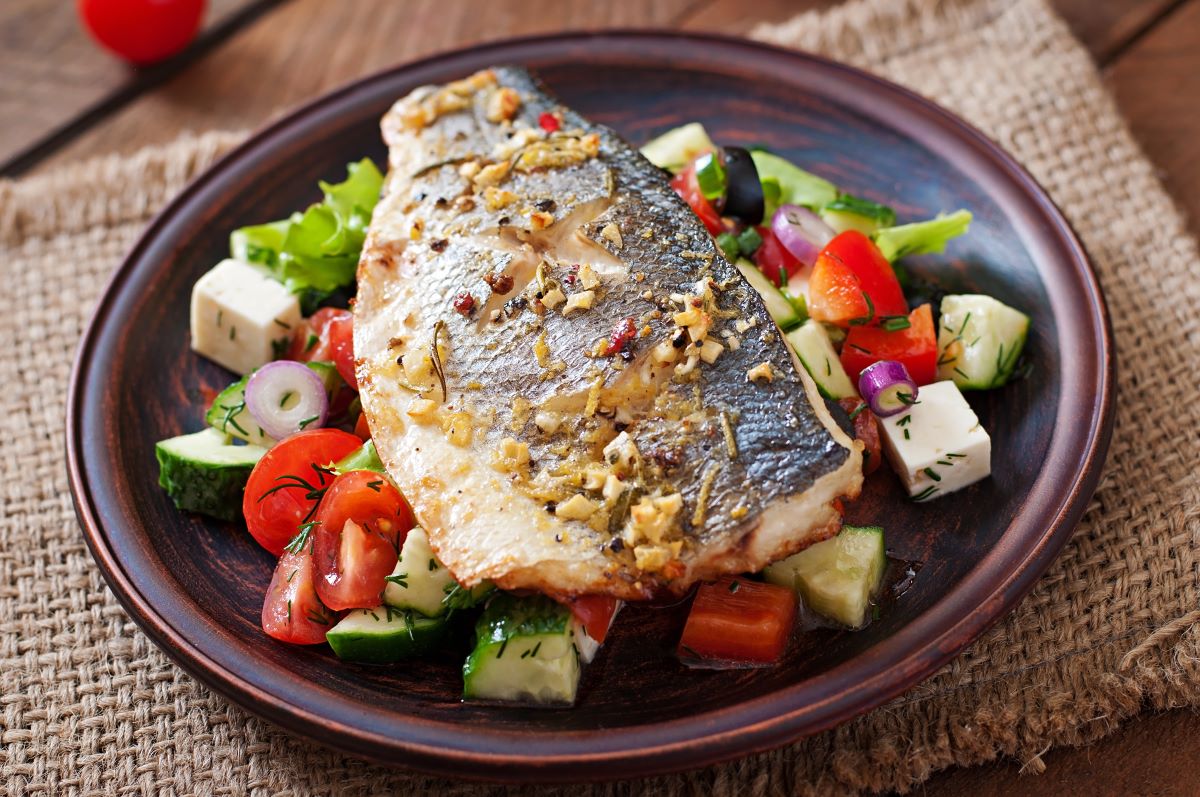 Baked Sea Bass on a Bed of Greek Salad