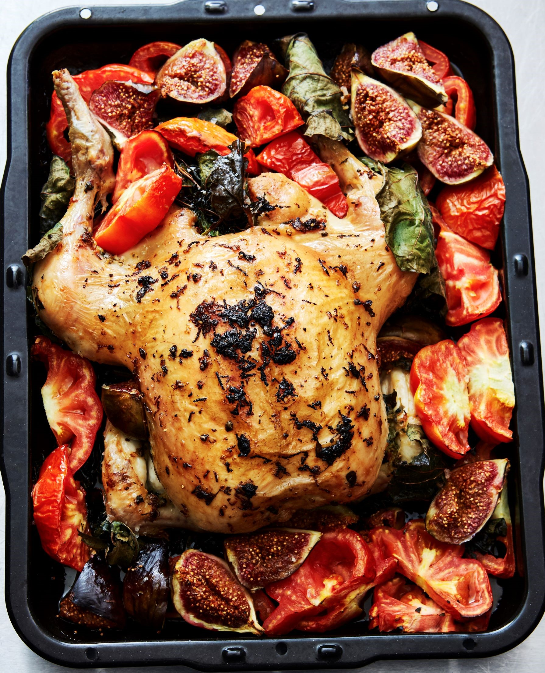 Roast Chicken in Fig Leaves, with Figs & Tomatoes